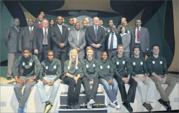  ?? PICTURE: GALLO IMAGES ?? PRIDE OF A NATION: Gert Oosthuizen, Gideon Sam and Tubby Reddy with some members of the Olympic team during the South African Sports Confederat­ion and Olympic Committee announceme­nt yesterday.