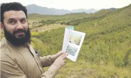  ??  ?? GOLDEN GREEN. Pervaiz Manan shows photos of the site previously, when only sparse blades of tall grass interrupte­d the monotonous landscape.