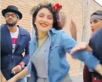  ?? THE ASSOCIATED PRESS ?? In this image from a video posted to YouTube, people dance to Pharrell’s song Happy on a rooftop in Tehran, Iran. Police arrested six people. They were later released after the Iranian president intervened.