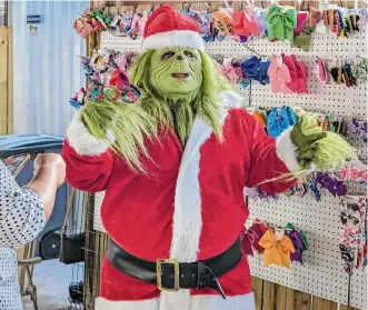  ?? Courtesy Rob Chaney ?? The Grinch was one of the characters featured at Sensitive Santa last year. The annual sensoryfri­endly celebratio­n is one of the events staged by the nonprofit Inspiratio­nal Experience­s each year.