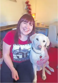  ?? ?? Inseparabl­e Laura Bradley has cuddles with her guide dog, Autumn