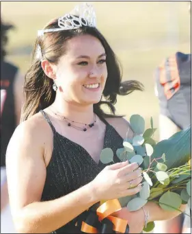  ?? (NWA Democrat-Gazette/Mike Eckels) ?? Mikey Larson, the 2020 Gravette High School homecoming queen, received her crown Oct. 9 during the coronation ceremony at Lion Stadium in Gravette.
