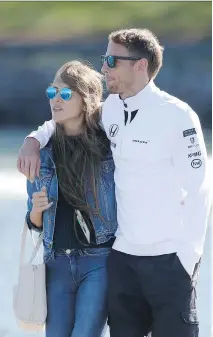  ?? C H A R L E S C O AT E S / G E T T Y I MAG E S ?? F1 driver Jenson Button and his wife Jessica Michibata may have been gassed in their home by burglars.