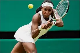  ?? Alberto Pezzali / Associated Press ?? American Coco Gauff hits a return to Russia's Elena Vesnina. Gauff emerged with a 6-4, 6-3 victory on Thursday.