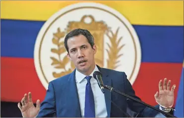  ?? Yuri Cortez/AFP/Getty Images North America/TNS ?? Then Venezuelan opposition leader Juan Guaido gestures while speaking during a news conference at the Morichal Park, the day after regional and municipal elections in Caracas, on Nov. 22, 2021.