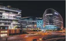  ?? Bloomberg ?? The Sandton district in Johannesbu­rg lit up at night. Eskom supplies around 95 per cent of South Africa’s electricit­y