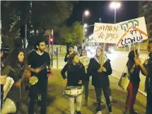  ?? (Courtesy Amir Pavilion) ?? FREE JERUSALEM activists protest in front of Mayor Nir Barkat’s home on Tuesday night.