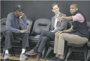  ?? — CRAIG ROBERTSON/POSTMEDIA FILES ?? Coach Dwane Casey, left, GM Jeff Weltman and president Masai Ujiri of the Toronto Raptors talk over strategy in 2015. Weltman left the Raptors to become president of basketball operations with the Orlando Magic.