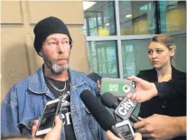  ?? CP PHOTO ?? Troy Pfeiffer, father of homicide victim Cody Pfeiffer, talks to members of the media in Calgary, Thursday. Calgary police say two people facing charges related to a quadruple homicide this summer knew all the dead.