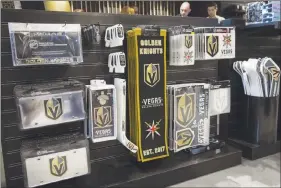  ?? L.E. BASKOW ?? Golden Knights merchandis­e is on display at The Armory, the team’s official store at T-mobile Arena. The team also will operate a merchandis­e store in Mccarran Internatio­nal Airport.
