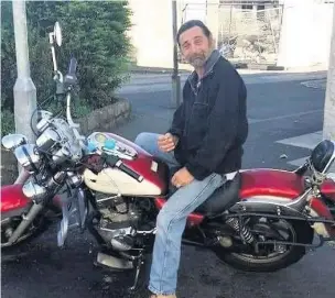  ??  ?? Paul Grihault on one of his motorbikes