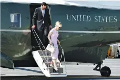  ??  ?? US Treasury Secretary Steve Mnuchin and his wife Louise Linton arrive on the Marine One helicopter with President Donald Trump aboard the deck of the aircraft carrier USS Gerald R. Ford for its commission­ing ceremony at Naval Station Norfolk in...