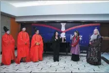  ?? Turandot. PROVIDED TO CHINA DAILY ?? He Hui (third from right) gives advice to Shanghai Opera House’s singers performing arias from the opera