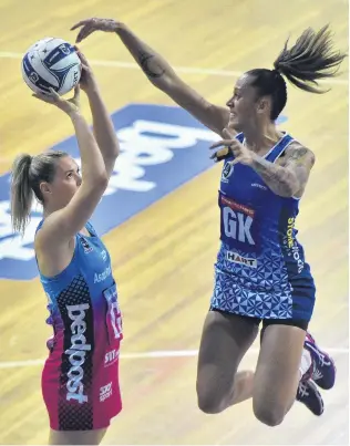  ?? PHOTO: GREGOR RICHARDSON ?? Pressure shot . . . Southern Steel goal shoot Lenize Potgieter calmly lines up a goal as Northern Mystics goal keep Erena Mikaere defends during an ANZ Championsh­ip match at the Edgar Centre in Dunedin last night.