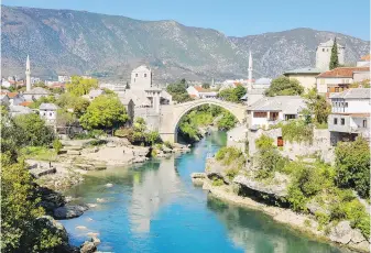  ?? CAMERON HEWITT, RICK STEVES’ EUROPE ?? Mostar and its famous bridge, rebuilt after the war.