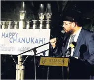  ??  ?? Rabbi Yaakov Raskin of Jamaica addressing the gathering during the 2018 Chanukah celebratio­ns held on the grounds of Terra Nova All-Suites Hotel on Monday, December 3.