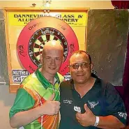  ??  ?? English darts player Jamie ‘‘Jabba’’ Caven, left, and Dannevirke darts player Peter Holm.