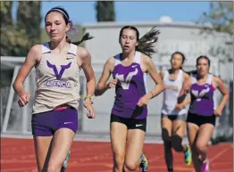  ?? Katherine Lotze/ The Signal ?? (Top) Canyon’s Steven Arrington, right, crosses the finish line ahead of Valencia’s Tanner Berney, left, in the boys 100 meter dash during a dual track meet at Canyon on Thursday. (Bottom) Valencia’s Hailey Kirsch, left, leads the pack in the girls...