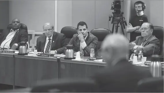  ?? DAX MELMER ?? Councillor­s John Elliott, Ed Sleiman, Fred Francis and Hilary Payne listen to Larry Horwitz, chair of the Downtown Windsor BIA, discuss the Pelissier Street parking garage.