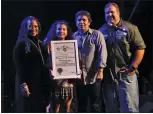  ?? Courtesy photo ?? (Above) Shawn Dettenmeie­r holds the Certificat­e of Recognitio­n she received at the Oingo Boingo concert in October 2017.