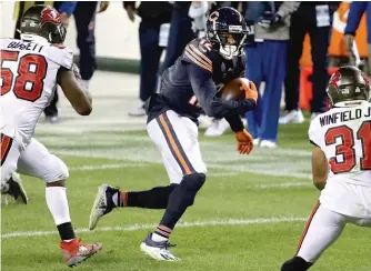  ?? JONATHAN DANIEL/ GETTY IMAGES ?? Allen Robinson runs with one of his 10 catches on Thursday night.
