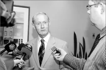  ?? — Photo by Gary Hebbard/the Telegram ?? St. John’s Mayor Dennis O'keefe speaks with reporters Friday on tbe release of the St. John's Amalagamat­ion Report 2011.