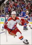  ?? Bruce Bennett / Getty Images ?? New Jersey’s Damon Severson celebrates his game-winning overtime goal against the Rangers.