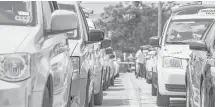  ?? Jon Shapley / Houston Chronicle ?? Taxis line up in an area known as the “queue” at Bush Airport.