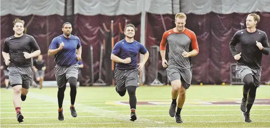  ?? STaffphoTo­sbypaTRICK­WhITTEMoRE ?? ROOKIES ON THE RUN: Prospects (from left) Bobby Poyner, Josh Ockimey, Michael Chavis, Ty Buttrey and Jalen Beeks run sprints during yesterday’s Red Sox rookie developmen­t program at Boston College.