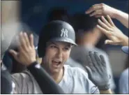  ?? FRED THORNHILL/THE CANADIAN PRESS VIA ASSOCIATED PRESS ?? Yankees’ Greg Bird celebrates in the dugout after hitting a three-run homer against the Blue Jays in the fifth inning of Saturday’s game at Toronto.