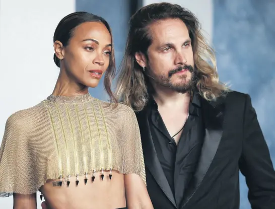  ?? REUTERS ?? Zoe Saldana and Marco Perego arrive at the Vanity Fair Oscar party after the 95th Academy Awards, known as the Oscars, in Beverly Hills, California, March 12, 2023.