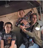  ?? FRANCISCO SECO/AP ?? Yana Skakova and her son Yehor, who fled from Lysychansk, sit in an evacuation train in Pokrovsk, eastern Ukraine, on Saturday. Fighting has raged around Lysychansk and neighbouri­ng Sievierodo­netsk, the last major cities under Ukrainian control in the Luhansk region.