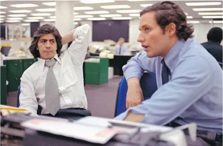  ?? THE ASSOCIATED PRESS ?? In this May 7, 1973 file photo, reporters Bob Woodward, right, and Carl Bernstein, whose reporting of the Watergate case won them a Pulitzer Prize, sit in Washington Post newsroom. Forty-five years later, they’re still making news.