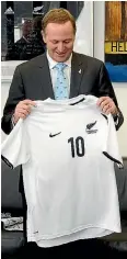 ??  ?? Former Prime Minister John Key with an All Whites shirt he was presented in in 2010. Key has predicted the All Whites to beat Fiji 5-0 when the two teams meet in Wellington tonight.