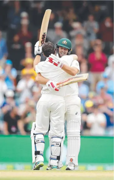  ?? Picture: GETTY IMAGES ?? DROUGHT BROKEN: Joe Burns celebrates ending Australia’s century drought yesterday with Travis Head, against Sri Lanka at Manuka Oval.