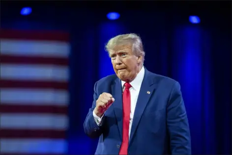  ?? THE ASSOCIATED PRESS ?? Former President Donald Trump pumps his fist after speaking at the Conservati­ve Political Action Conference, March 4, 2023, Oxon Hill, Md. The Manhattan district attorney’s office appears to be getting close to a decision on whether to charge Donald Trump over hush-money payments to Stormy Daniels during his 2016presid­ential campaign.