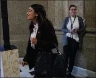  ?? The New York Times/TOM BRENNER ?? Rep. Alexandria Ocasio-Cortez heads to her meeting with House Speaker Nancy Pelosi on Friday. She was not immediatel­y available to reporters afterward.