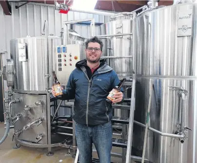  ?? PHOTO: JOSH WALTON ?? Good brew . . . Altitude brewing partner Eliott Menzies shows off his awardwinni­ng beer.