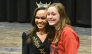  ?? (Pine Bluff Commercial/I.C. Murrell) ?? Miss Arkansas Ebony Mitchell of Conway poses with White Hall High School senior Cameron Cobb at the new fine arts center on campus Tuesday.