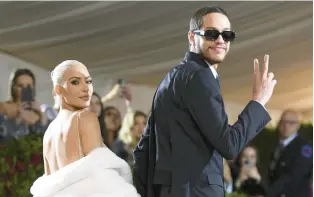  ?? EVAN AGOSTINI/INVISION ?? Kim Kardashian, wearing Marilyn Monroe’s gown, and Pete Davidson attend the Met gala May 2 in New York. The couple broke up in August.