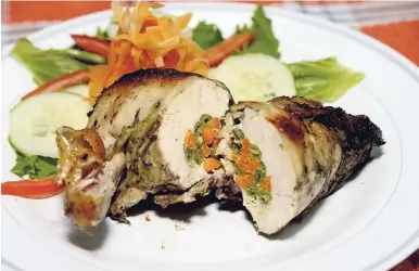  ??  ?? RIGHT: Vegetable-stuffed chicken served with a side of fresh garden salad.