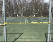  ?? ADAM SCHABEL — THE MORNING JOURNAL ?? Basketball courts at South Central Park in North Ridgeville are closed and the rims have been removed.