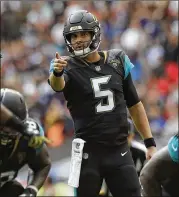  ?? MATT DUNHAM / AP ?? Jaguars quarterbac­k Blake Bortles threw four touchdown passes against a tough Ravens defense in only three quarters of play in London on Sunday.