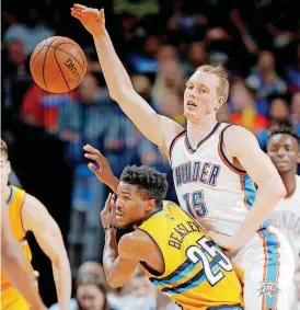  ?? [PHOTO BY BRYAN TERRY, THE OKLAHOMAN] ?? Kyle Singler battles for a loose ball with Denver’s Malik Beasley in the regular-season finale.