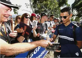  ??  ?? Not fit enough: Pascal Wehrlein signing autographs for fans on his arrival at the Albert Park Circuit in Melbourne ahead of the Australian Grand Prix first practice session on Friday. — AP