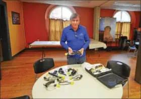  ?? RECORD FILE PHOTO ?? Pastor Charlie Muller of Victory Christian Church in Albany displays some of the illegal guns turned in Dec. 2during a gun buypack program in Troy.