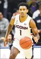  ?? Stephen Dunn / Associated Press ?? Christian Vital scored 15 of his 17 points in the second half of UConn’s seasonopen­ing win over Sacred Heart on Friday.