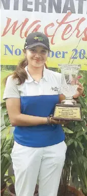  ??  ?? Princess Superal holds her trophy after a dominant win in the Sabah Int’l Juniors Masters.