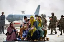  ?? Mark Andries/U.S. Marine Corps/AFP via Getty Images ?? Evacuee children wait for the next flight after being manifested Thursday at Hamid Karzai Internatio­nal Airport Thursday in Kabul, Afghanista­n.