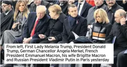  ??  ?? From left, First Lady Melania Trump, President Donald Trump, German Chancellor Angela Merkel, French President Emmanuel Macron, his wife Brigitte Macron and Russian President Vladimir Putin in Paris yesterday